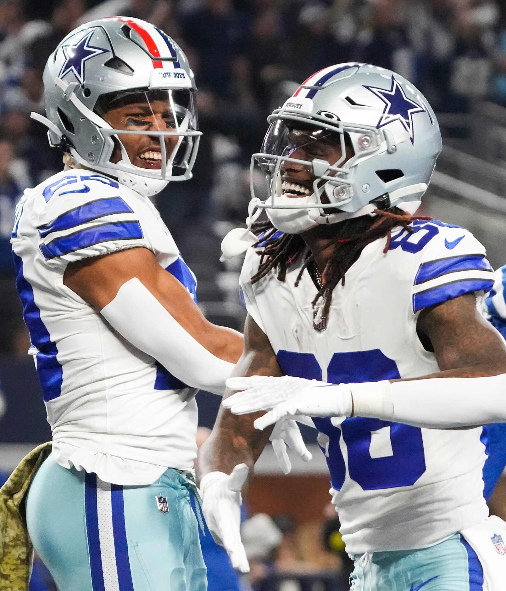 Dallas Cowboys wide receiver CeeDee Lamb (88) celebrates with Michael Gallup (13) after...