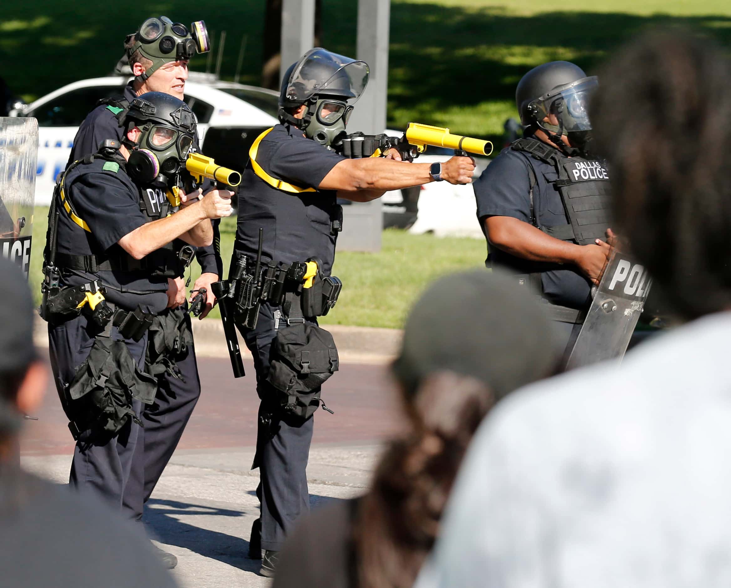Dallas police prepare to shoot towards protesters during a demonstration against police...