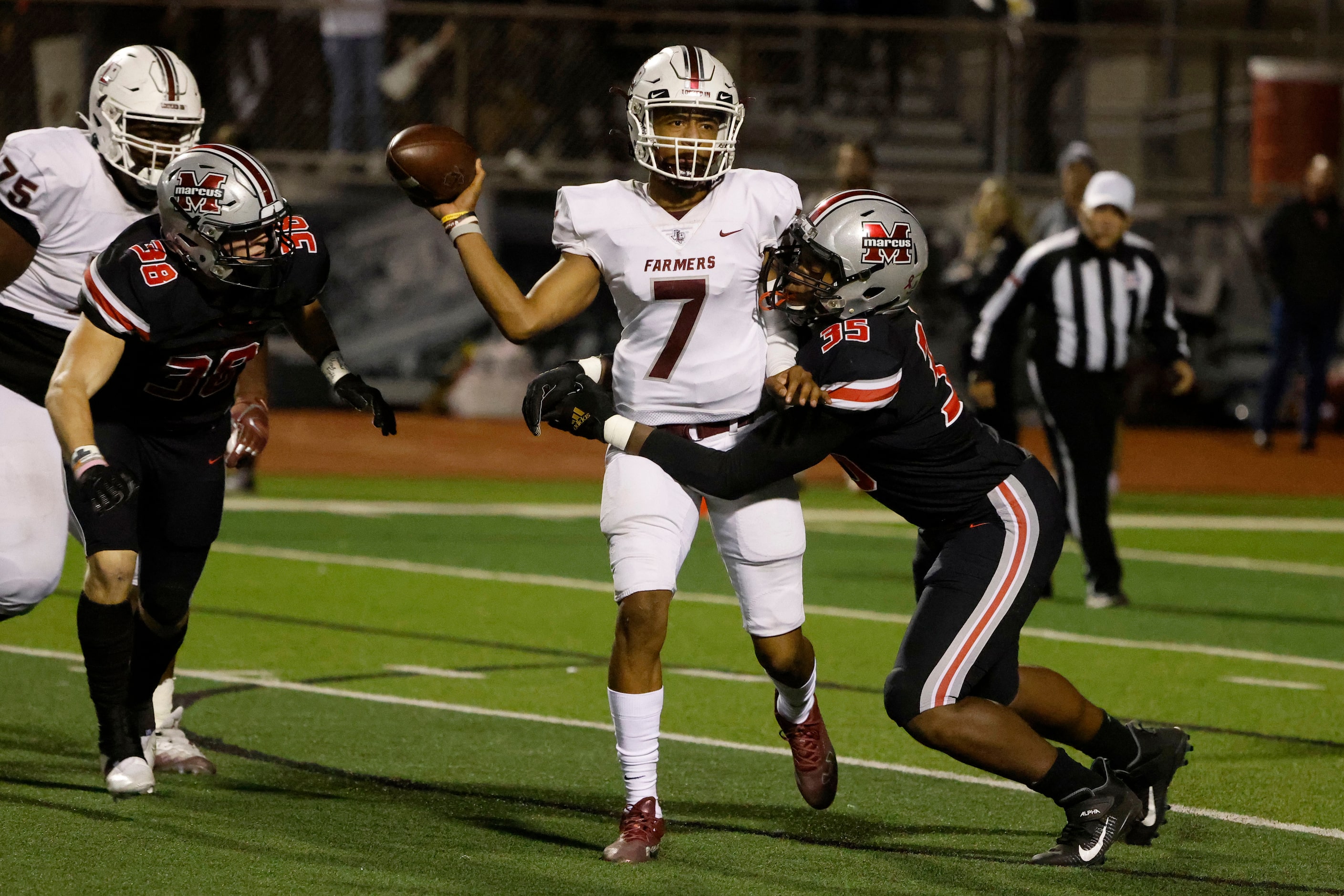 Flower Mound Marcus defensive lineman Will Upshaw (35) tries to take down Lewisville...