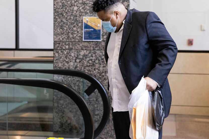 Jonathan Pitts walks off the escalator after visiting the pre-trial services office on...