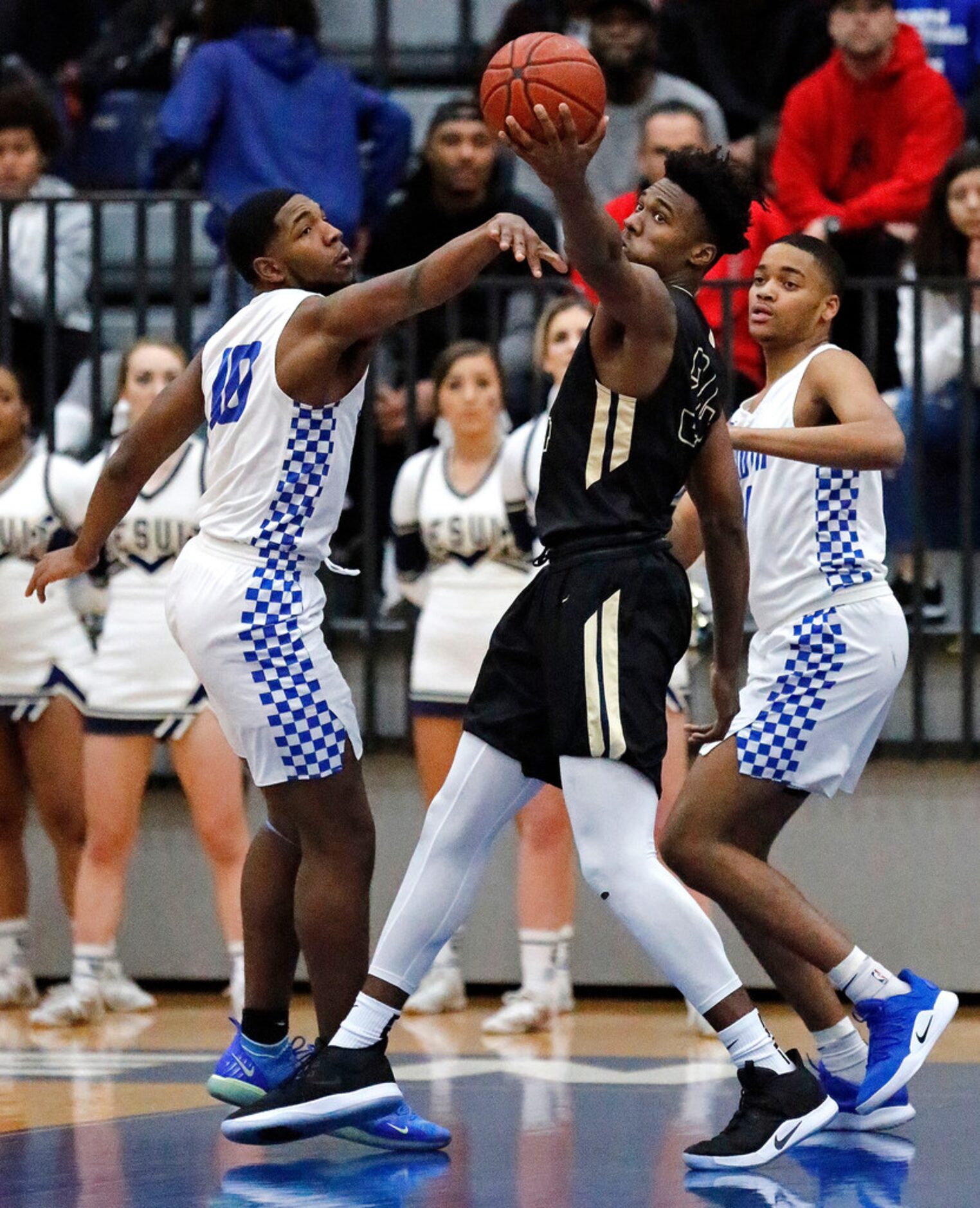 Dallas Jesuit forward Julius Marble (34) grabs a loose ball between South Garland High...