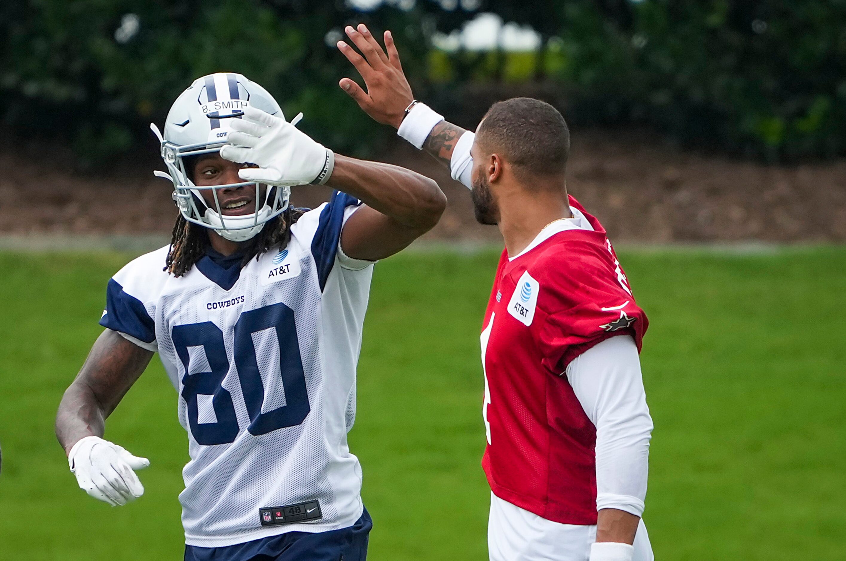 Dallas Cowboys wide receiver Brandon Smith (80) celebrates a catch with quarterback Dak...