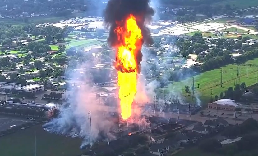 A pipeline fire in La Porte, Texas, sparks grass fires and burns power poles on Monday,...