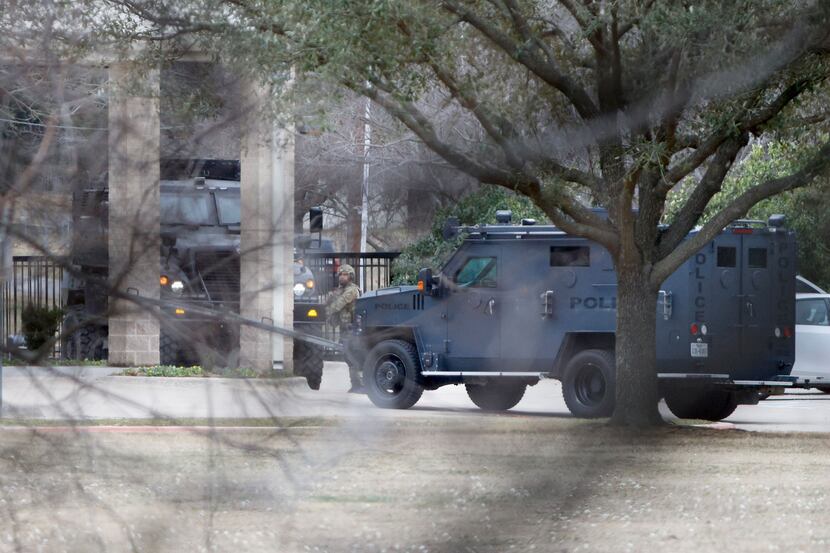 Armored vehicles are seen outside Congregation Beth Israel in Colleyville on Saturday.