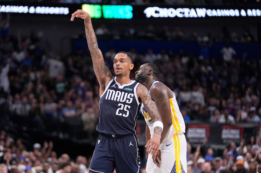 Dallas Mavericks forward P.J. Washington (25) reacts after scoring a basket against Golden...