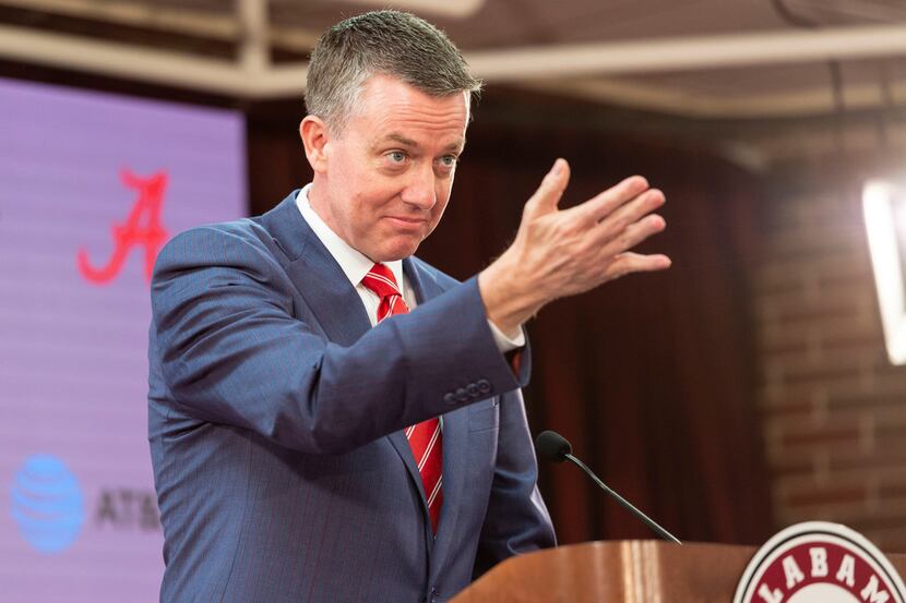 Alabama athletic director Greg Byrne gestures as he introduces Nate Oats as the new...