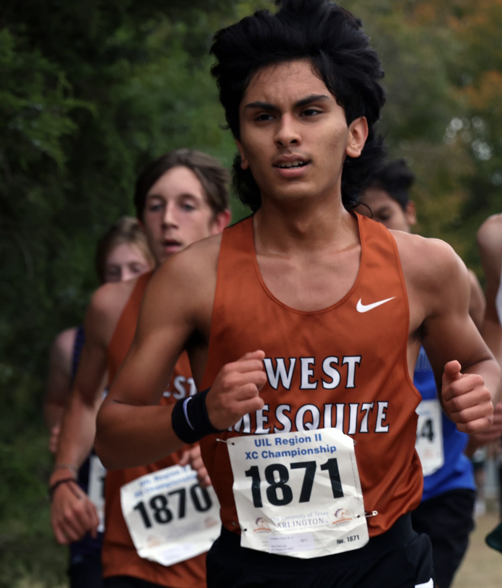 West Mesquite senior Leopoldo Cindo (1871) competes in the Boys Class 5A Region 2 race. He...