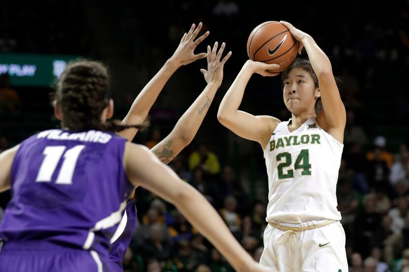 Kansas State's Peyton Williams (11) defends as Baylor's Natalie Chou (24) shoots during the...
