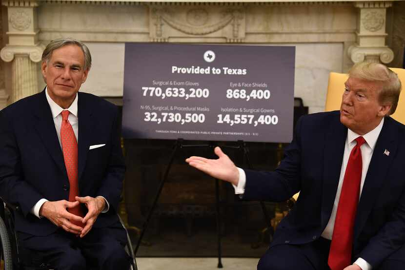 US President Donald Trump meets with Texas Governor Greg Abbott on May 7, 2020, in the Oval...