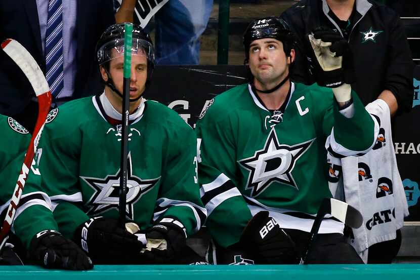 Dallas Stars' Jamie Benn (14) acknowledges the fans' cheers after scoring his third goal of...