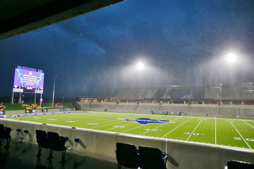 Sheets of rain come down during a weather delay holding up the start of a high school...