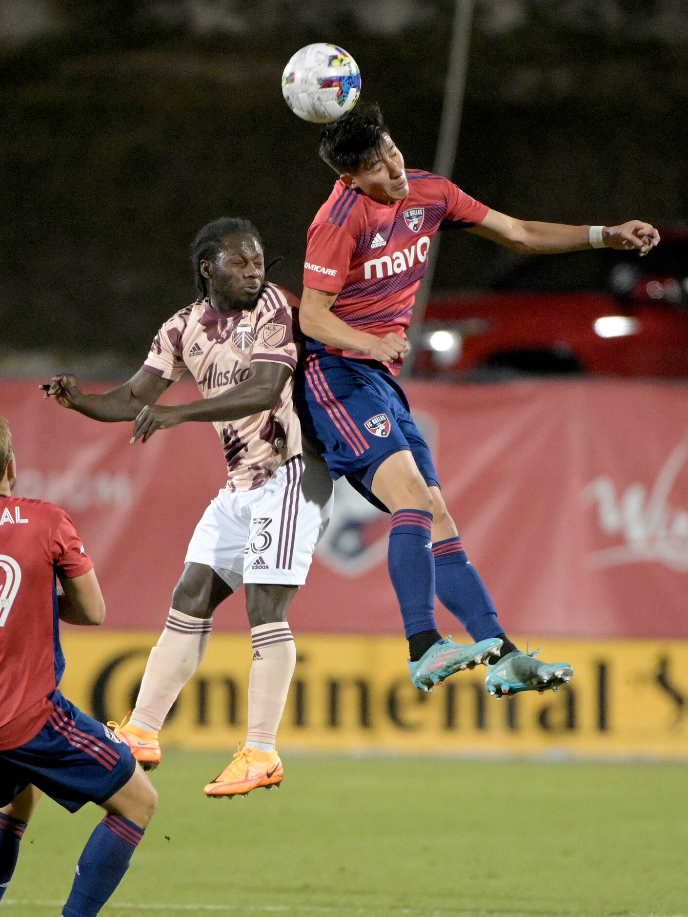 FC Dallas defender Marco Farfan (4) gets to a header over Portland Timbers forward Yimmi...