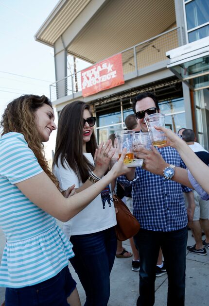 Elia Torres, Hileana Tamez, Jorge Muza and other friends (not shown) cheers at Texas Ale...