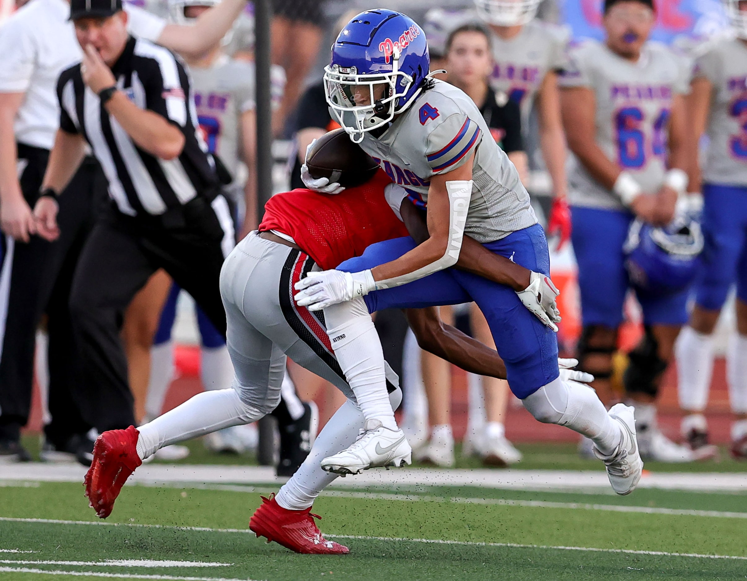 Richardson Pearce running back Andrew Casegrande (4) tries to avoid Flower Mound Marcus...