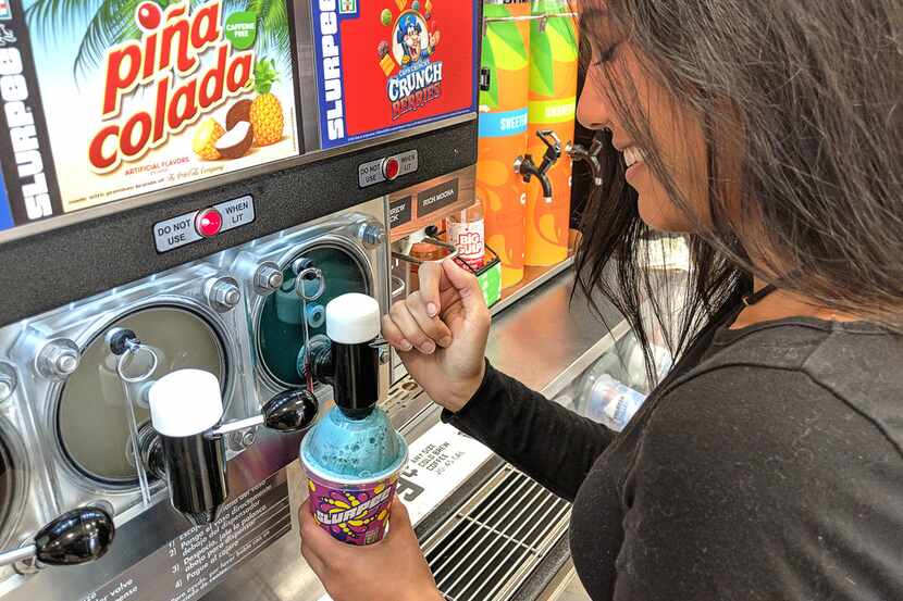 The new Cap'n Crunch Crunch Berries Slurpee is served into a small Slurpee cup.