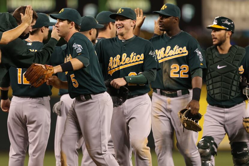SEATTLE, WA - SEPTEMBER 08: Members of the Oakland Athletics celebrate after defeating the...