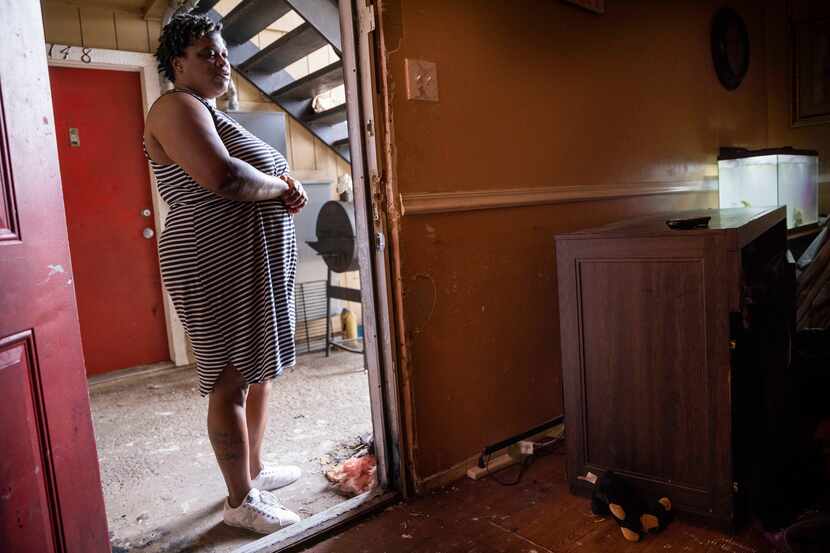 Roshunda Tilley stands at the door of her apartment, where multiple televisions were stolen...