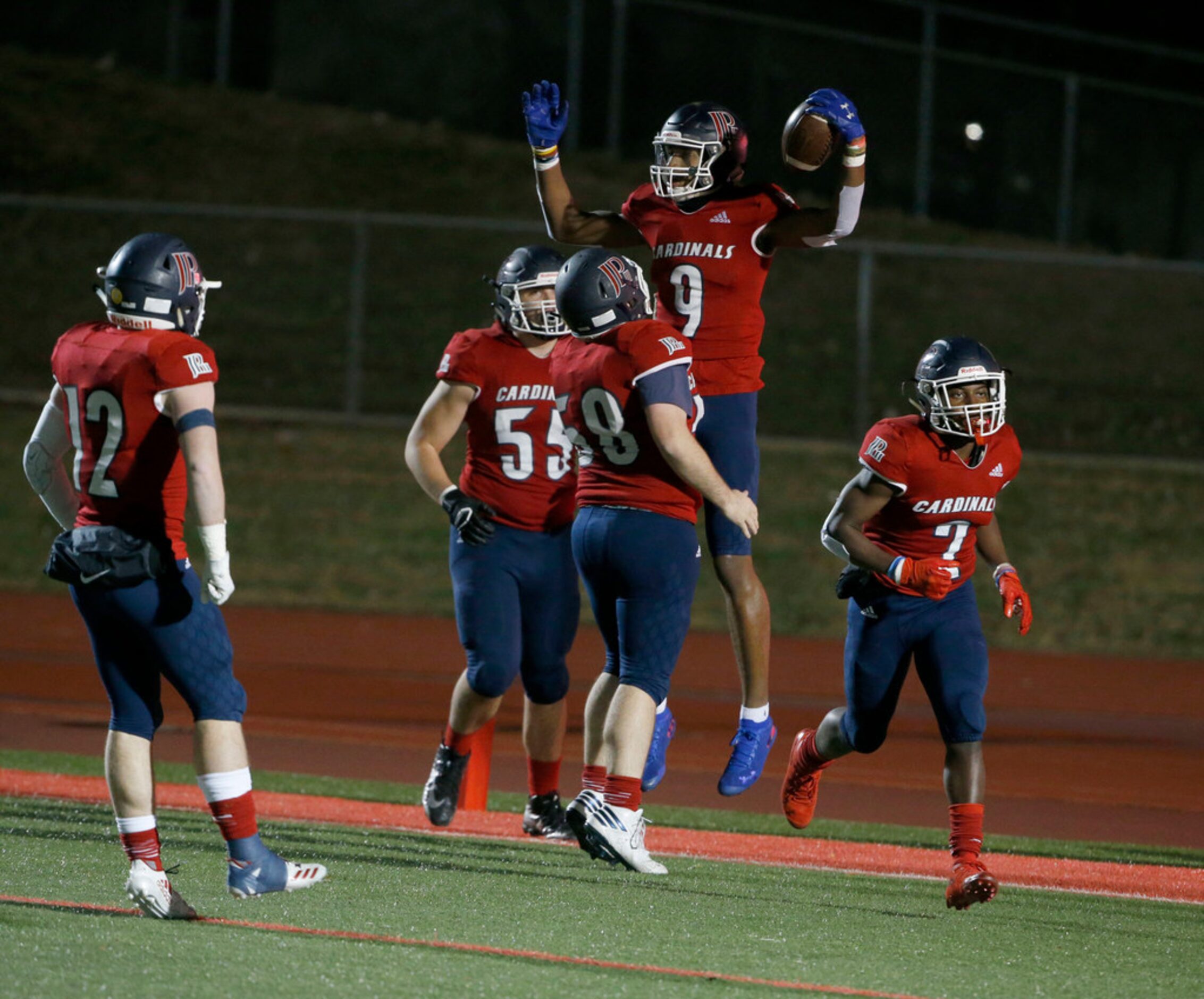 John Paul II Jerand Bradley (9) celebrates a touchdown reception with Zeke Skinner (58)...