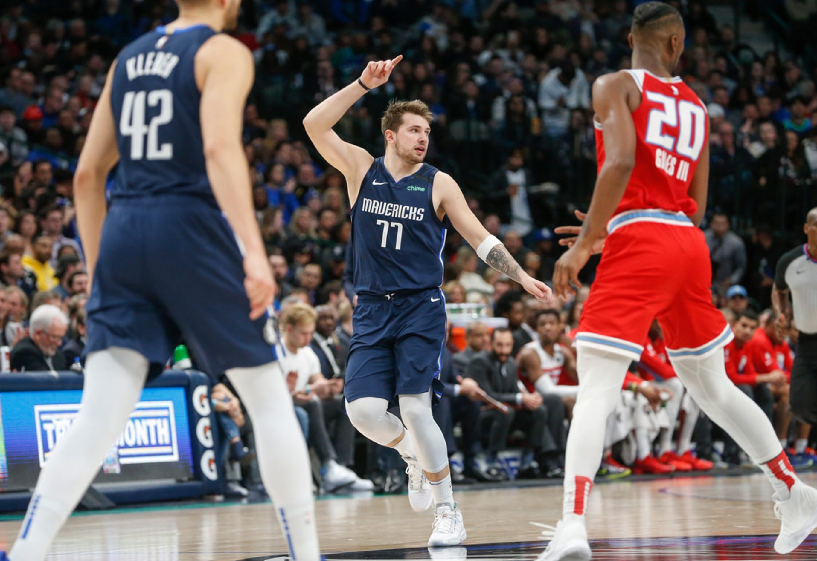 Dallas Mavericks guard Luka Doncic (77) celebrates scoring during the first half of an NBA...