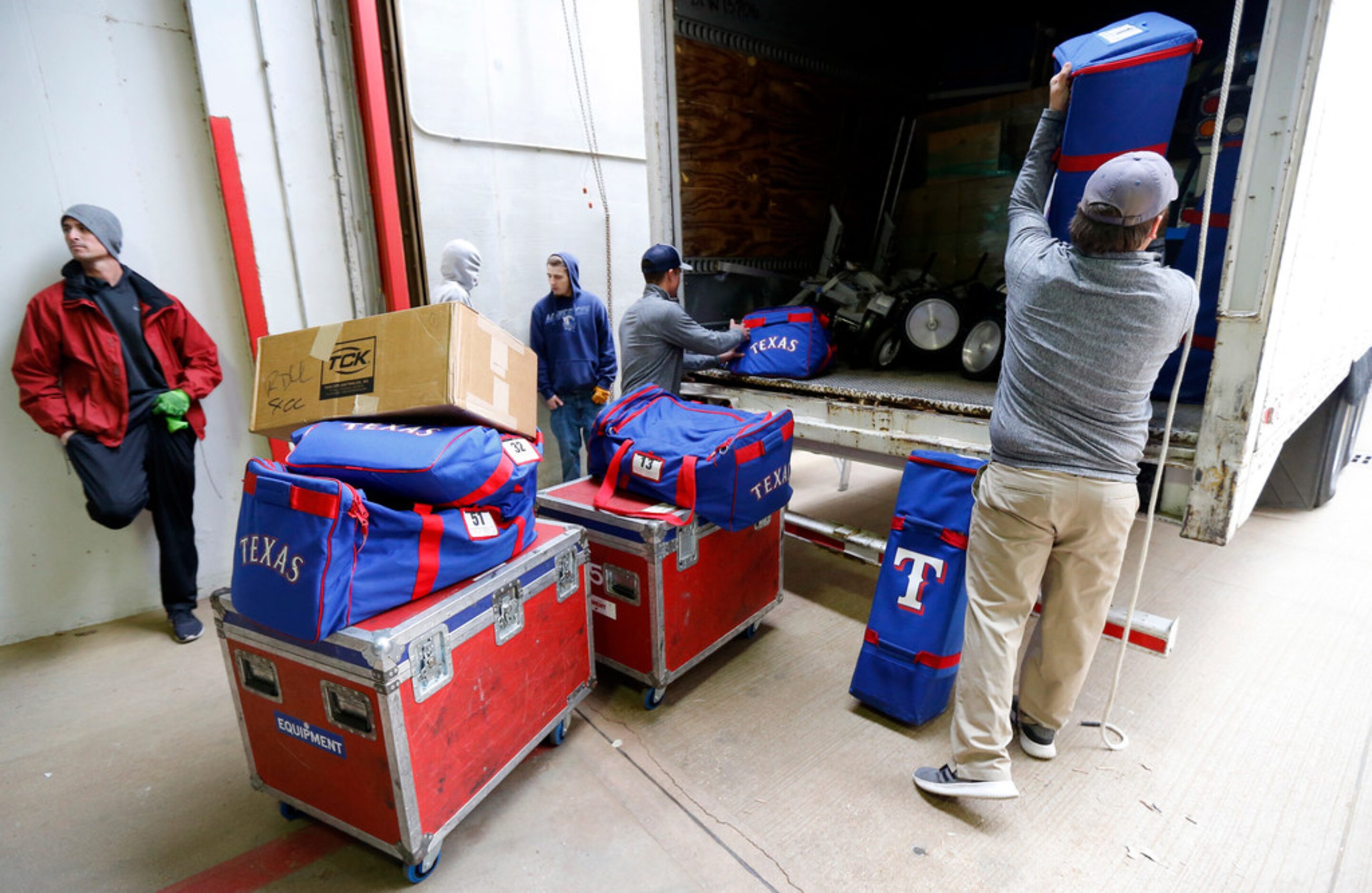 Crews load up Texas Rangers Spring Training moving truck before leaving Globe Life Park in...