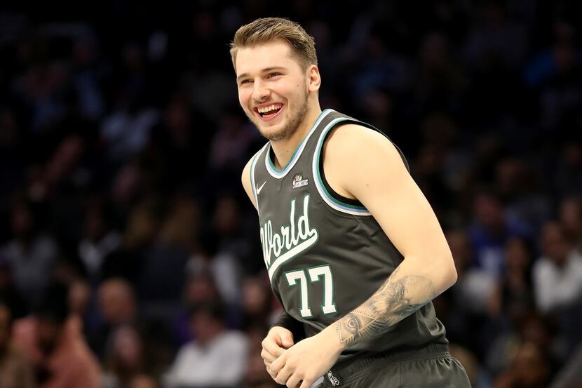 CHARLOTTE, NORTH CAROLINA - FEBRUARY 15: Luka Doncic #77 of the World Team reacts during the...