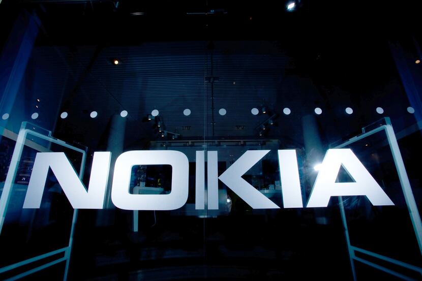 A logo sits on a glass panel at Nokia Oyj's flagship store in Helsinki, Finland, on Tuesday,...