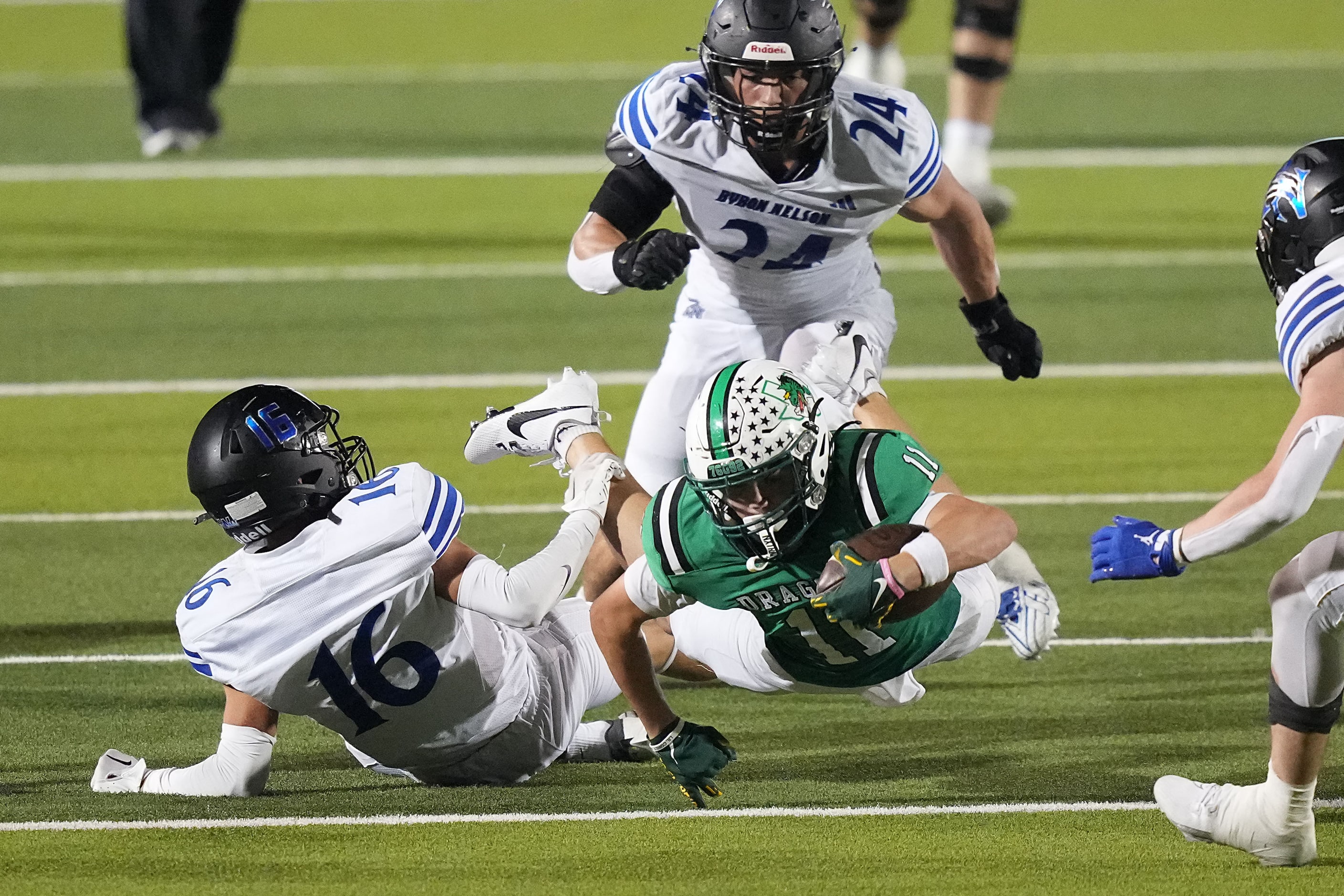 Southlake Carroll wide receiver Brock Boyd (11) dives for yardage past Trophy Club Byron...