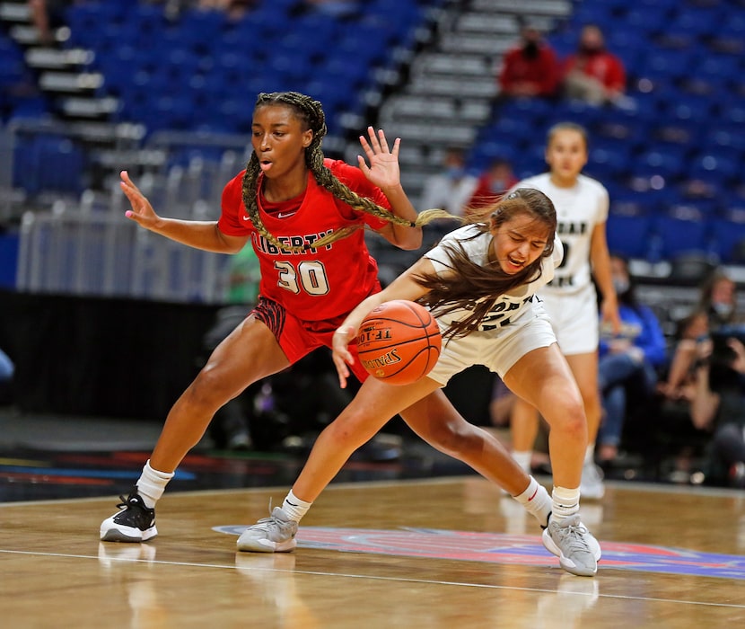 Frisco Liberty’s Jazzy Owens-Barnett (left) tried for a steal on Sarai Estupinan of  Cedar...