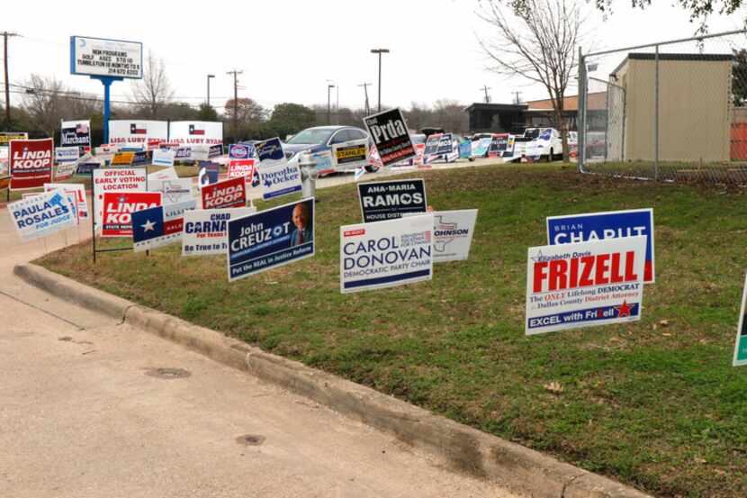 Political signs covered an area at the Fretz Park Branch of the Dallas Public Library in Far...