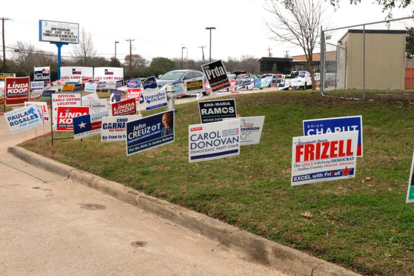 Political signs covered an area at the Fretz Park Branch of the Dallas Public Library in Far...