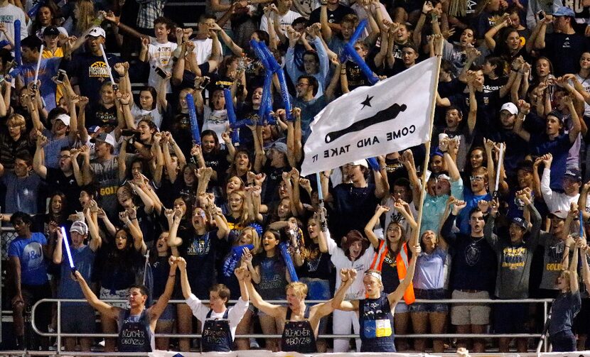 The Prestonwood Christian Academy student section celebrates a score during the first half...