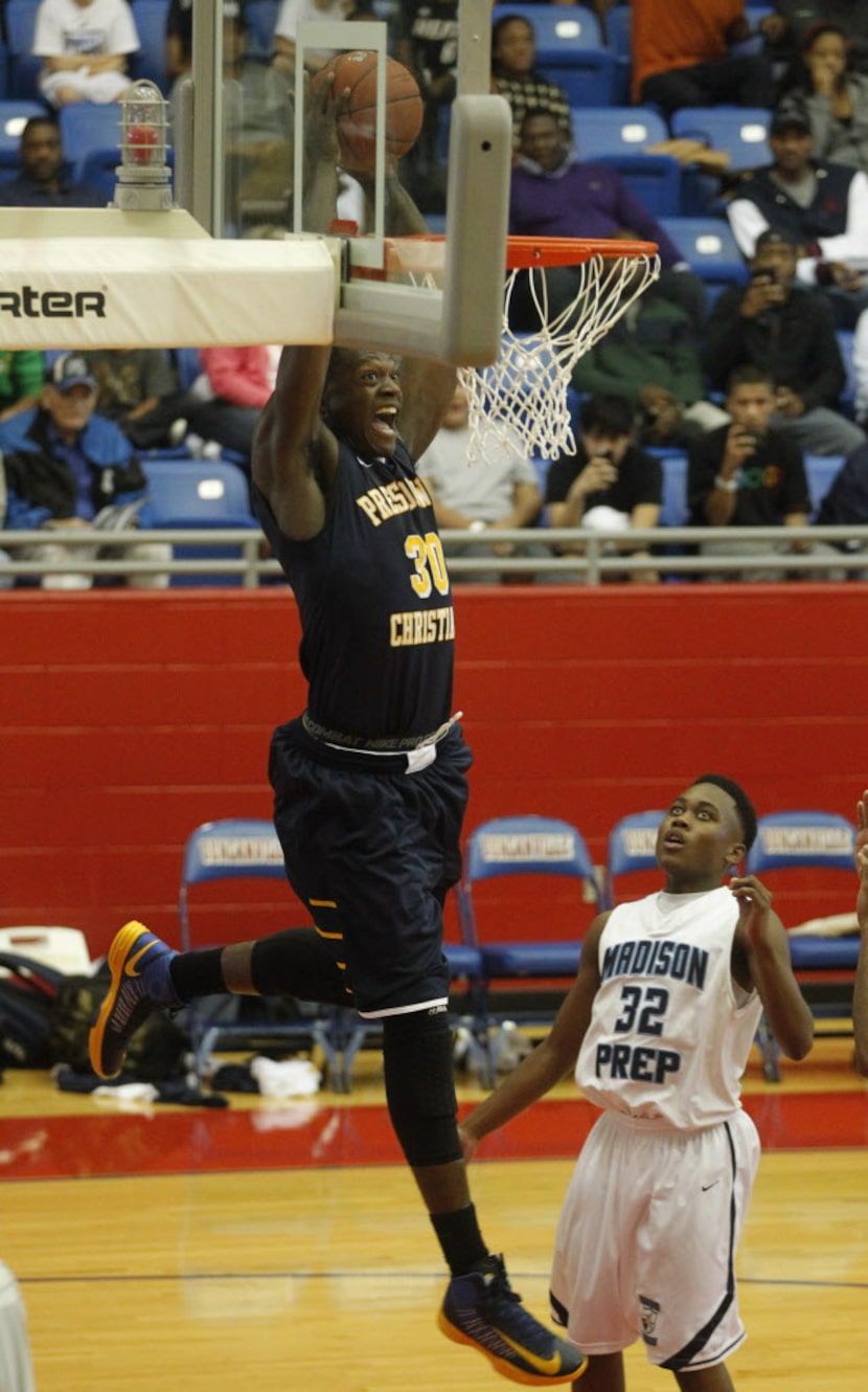 Prestonwood's Julius Randle (30) prepares to dunk in front of  Madison Prep Academy's Delvin...