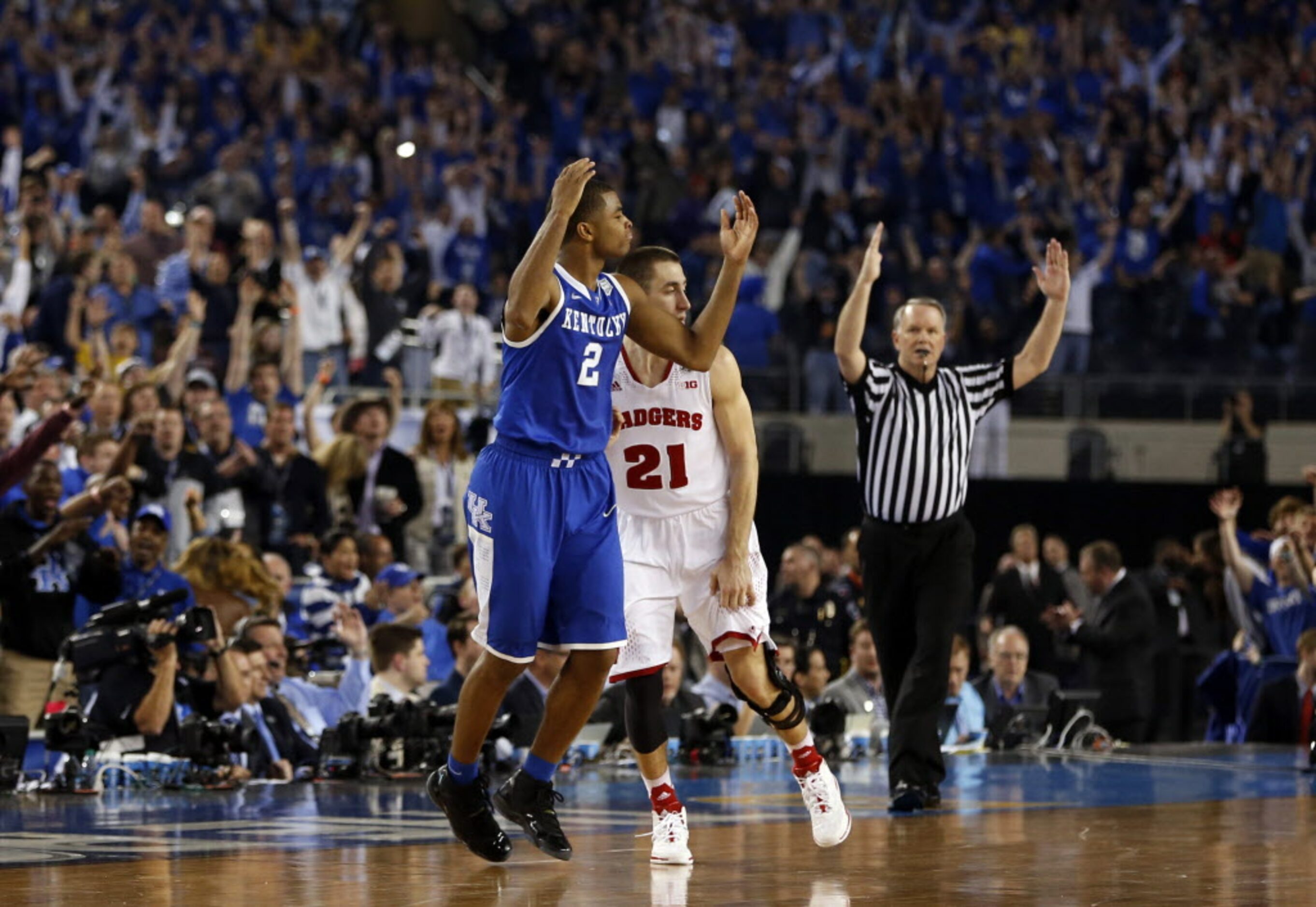 Kentucky Wildcats guard Aaron Harrison (2) celebrates after hitting the go ahead three point...