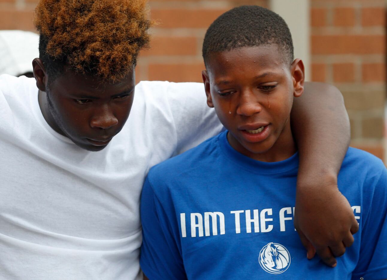MaQuesta Martin Jr. gets emotional as he talks about his friend Malik Tyler during a vigil...