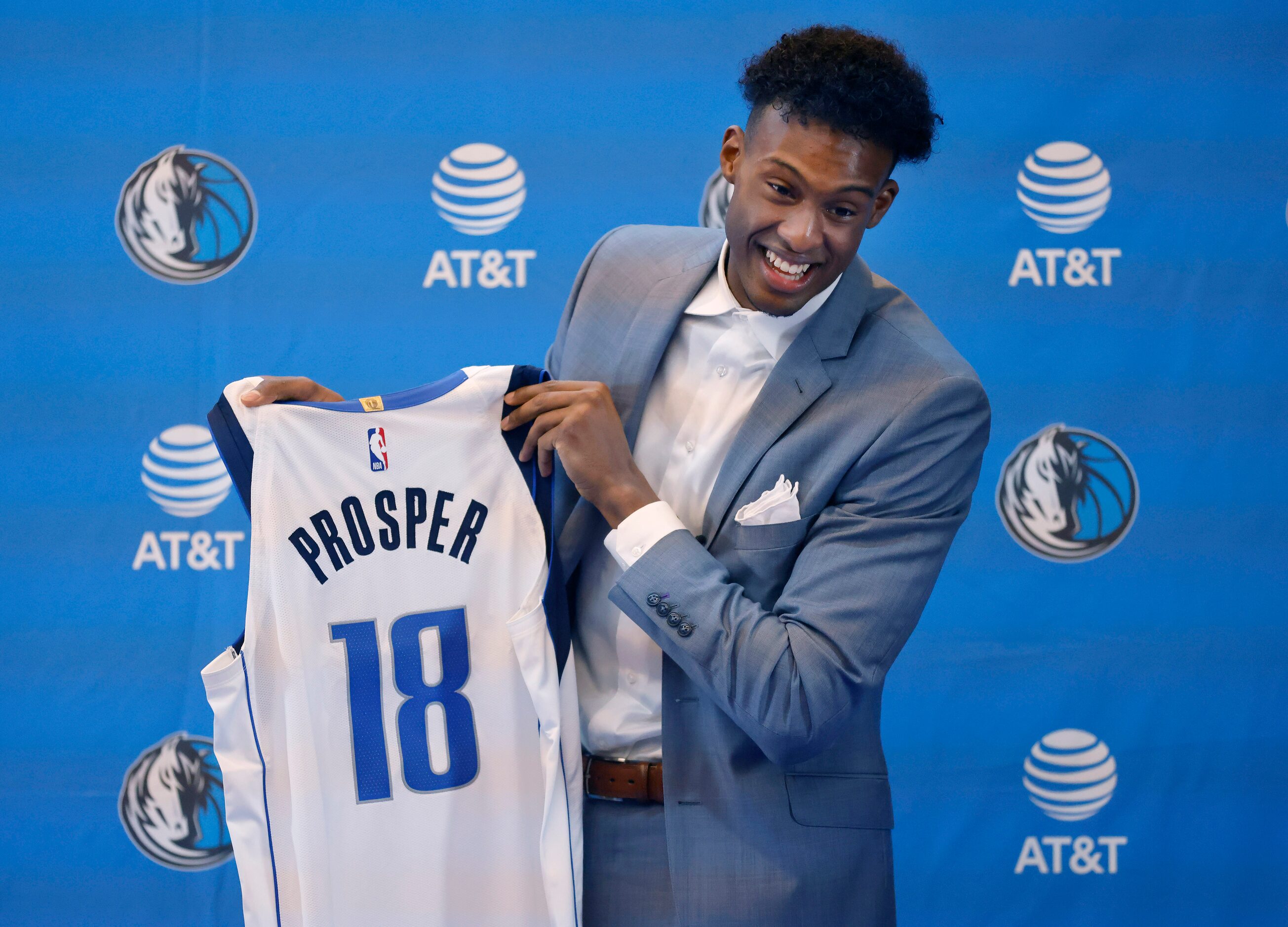 Newly drafted player Olivier-Maxence Prosper of Marquette shows of his new No. 18 jersey...