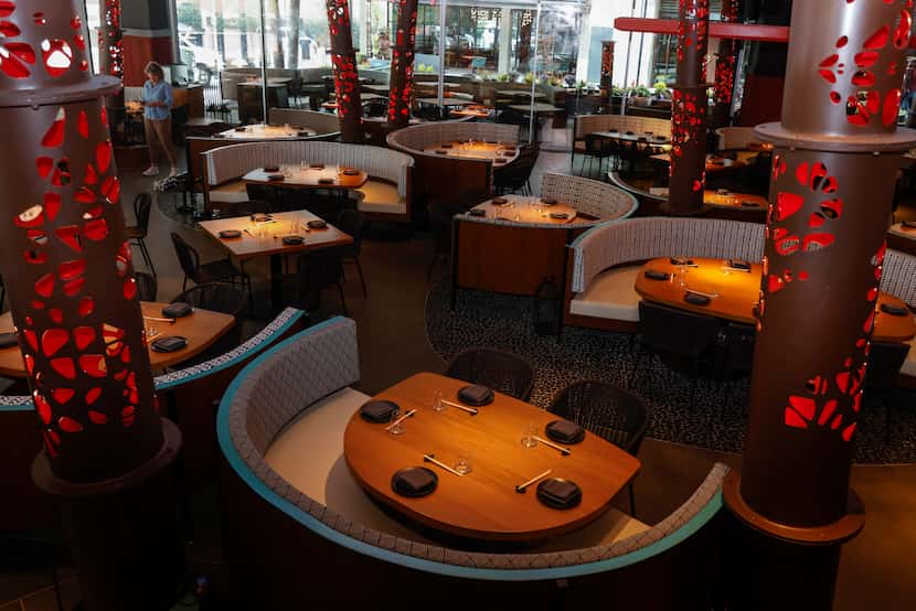Komodo Dallas is similar in style to Komodo Miami. The columns throughout the room are red...