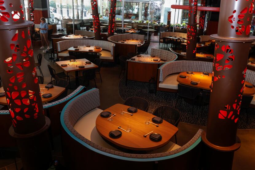 Komodo Dallas is similar in style to Komodo Miami. The columns throughout the room are red...