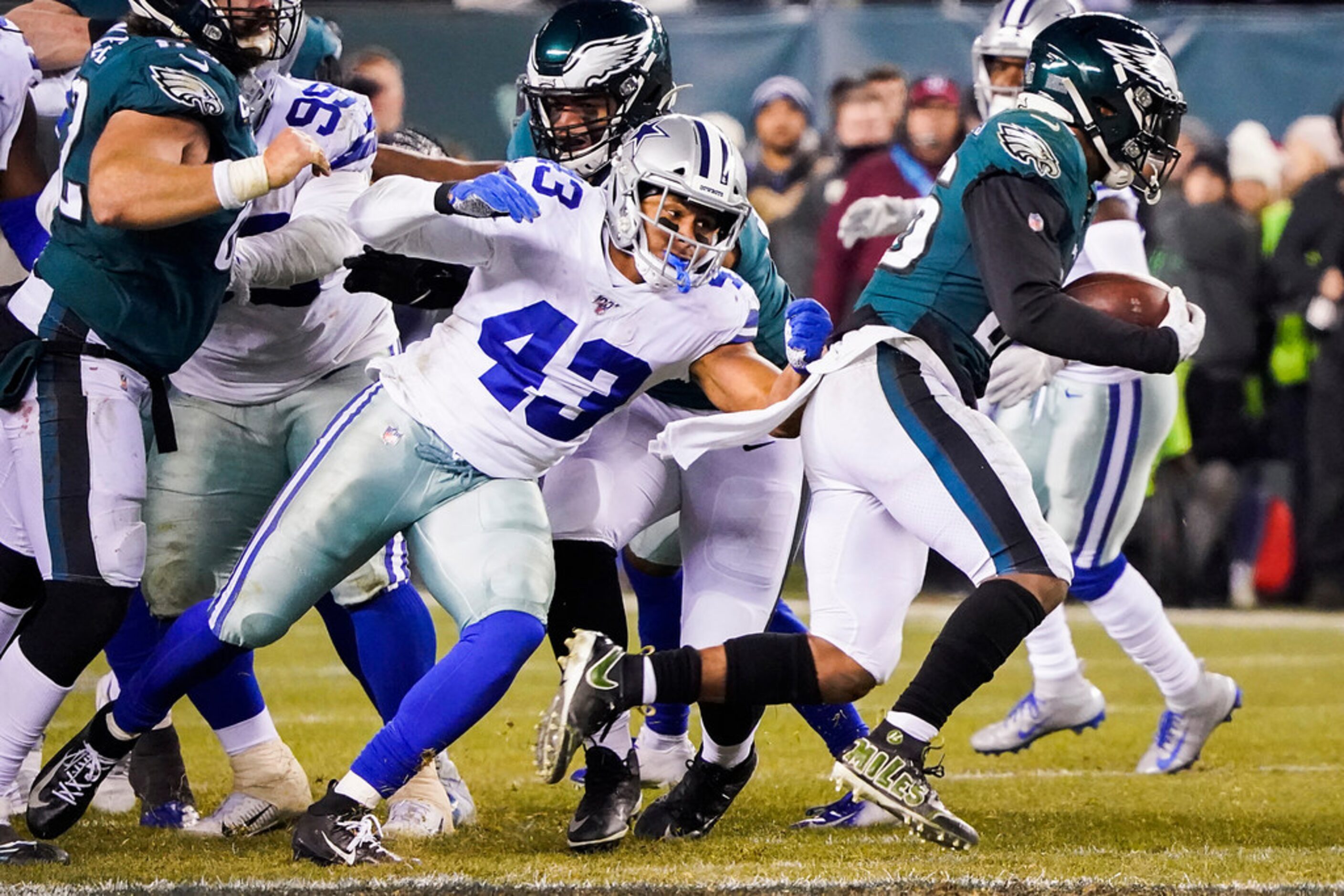 Philadelphia Eagles running back Miles Sanders (26) gets past Dallas Cowboys linebacker...