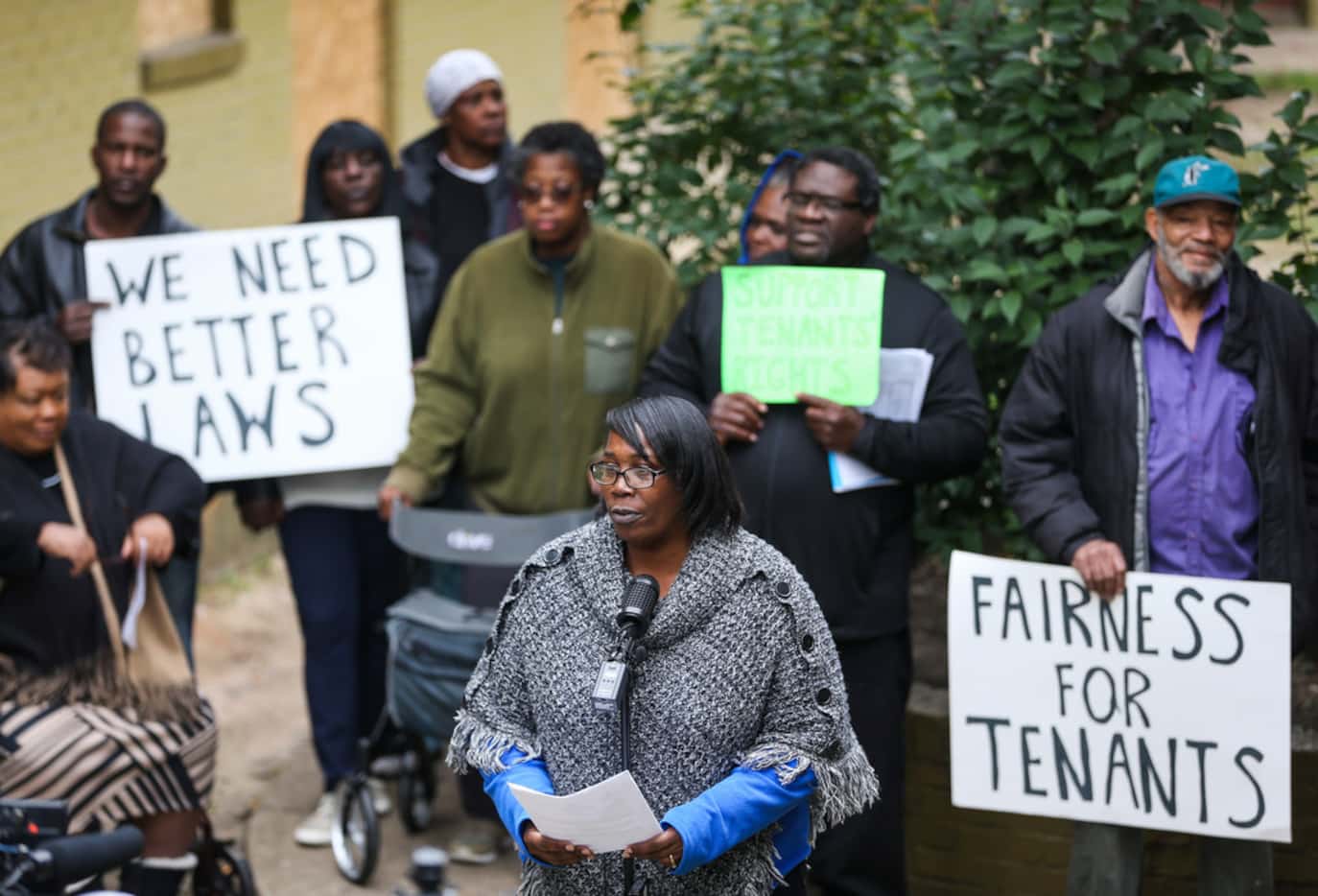 Odette Edwards, center, speaks at Bryan Song Apartments on Tuesday. Edwards, like all of the...