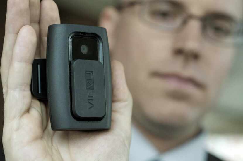  Dallas Police Department's Sgt. Derek McCarter is photographed with the L2 VieVU on Â...