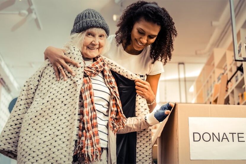 Elderly woman receiving a donated coat