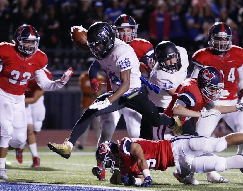 Hebron running back Derian Vaughn (28) scores a rushing touchdown to make the score 13-7 in...