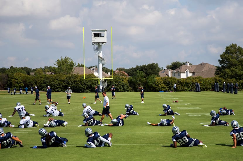 Dallas Cowboys stretch before a practice on Thursday, September 10, 2015 at Valley Ranch in...