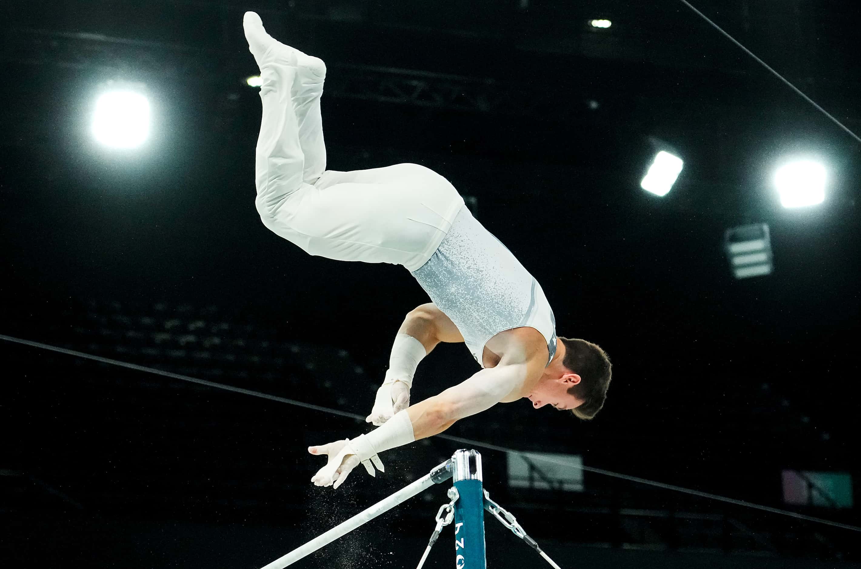 Brody Malone of the United States works on the high bar during gymnastics podium training...