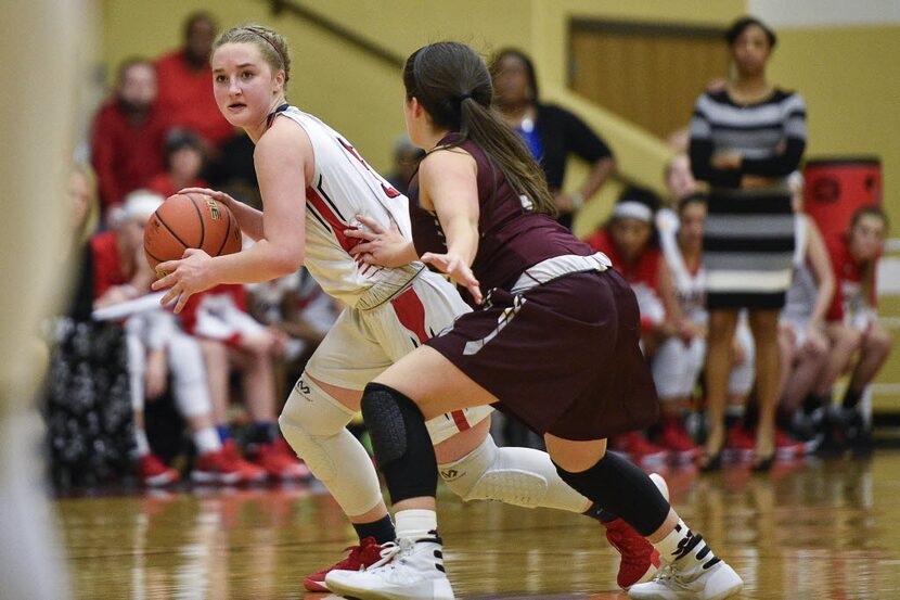 Ryan guard Julia McKeathen (5) runs a play during a basketball bi-district playoff game at...