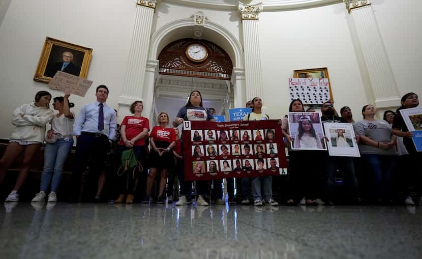 Veronica Mata, center, and other family members of the victims of the Uvalde shooting...