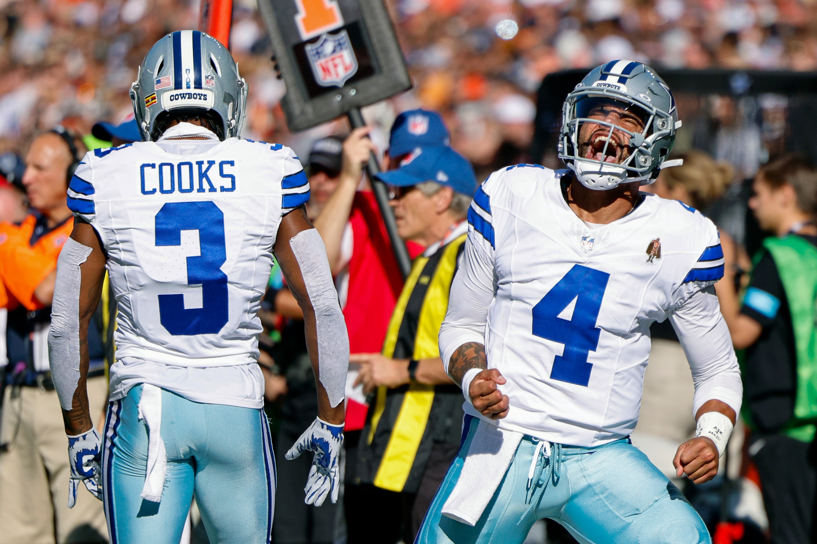 Dallas Cowboys quarterback Dak Prescott (4) reacts after throwing a touchdown to wide...