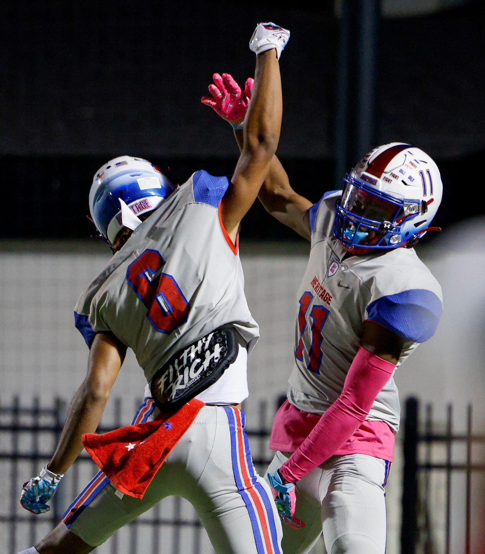 Midlothian Heritage wide receivers Sam Hopkins (6) and Xavier Moten (11) celebrate a...