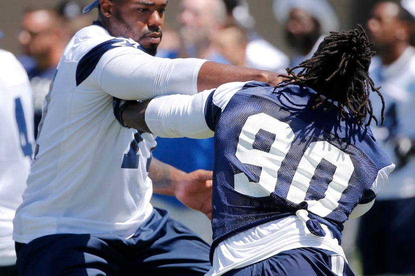 Dallas Cowboys defensive end Demarcus Lawrence (90) attempts to pass by Dallas Cowboys...