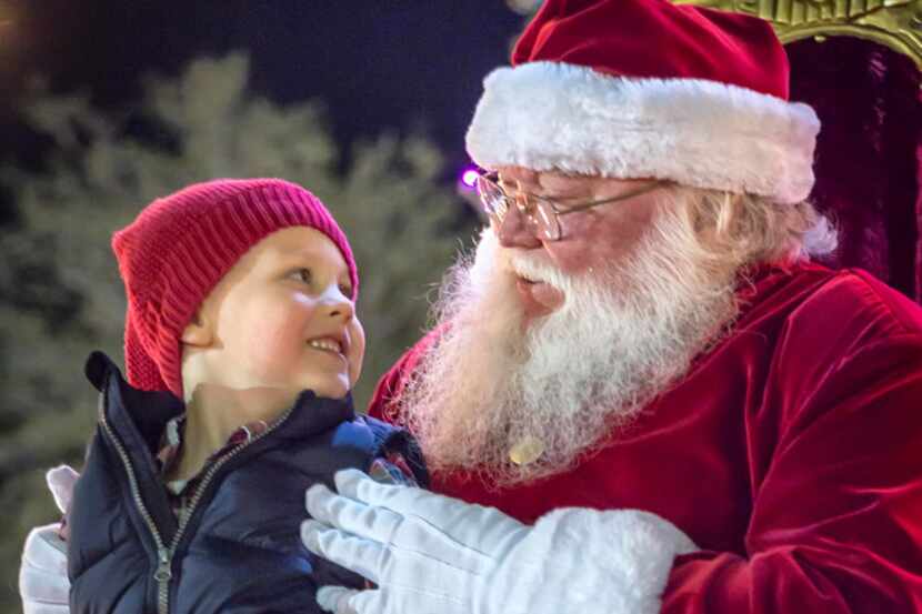 Jack O'Brien, 4, visits with Santa at Peppermint Park.